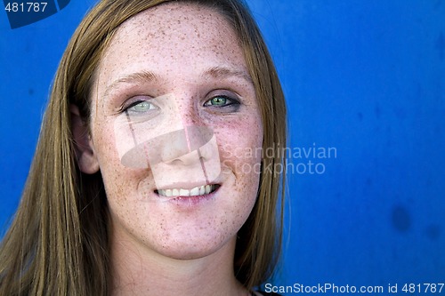 Image of Close up on a Beautiful Girl with Blue Background