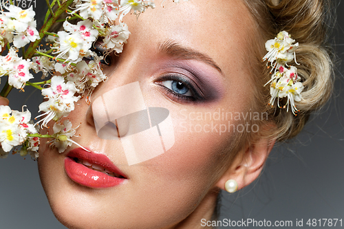 Image of beautiful girl with flowers in hair