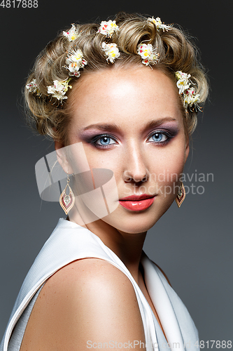 Image of beautiful girl with flowers in hair