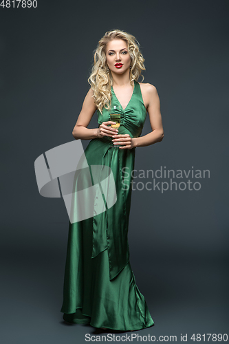 Image of beautiful girl in long dress with champagne