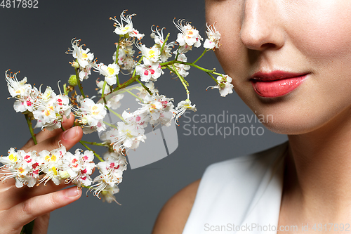 Image of beautiful girl with flowers in hair