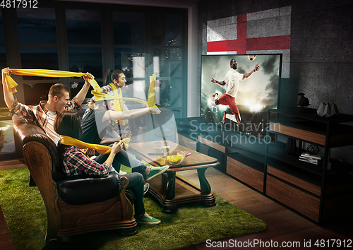 Image of Group of friends watching TV, sport concept, leisure activity