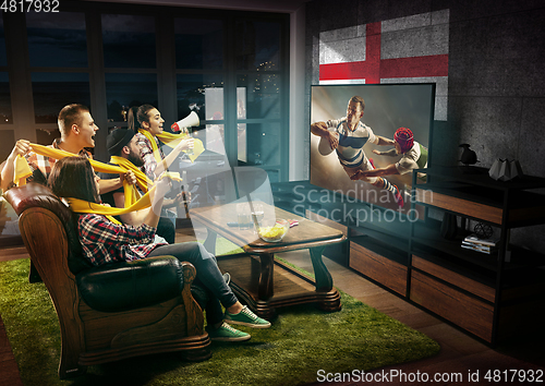 Image of Group of friends watching TV, sport concept, leisure activity