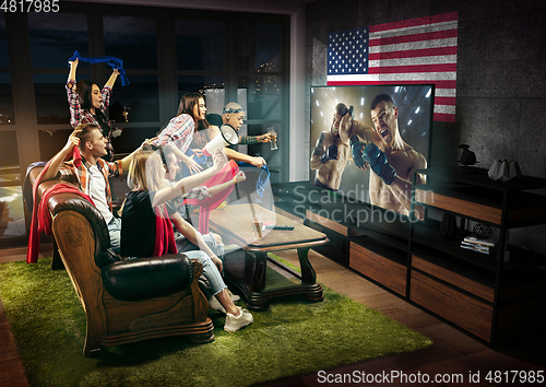 Image of Group of friends watching TV, sport concept, leisure activity
