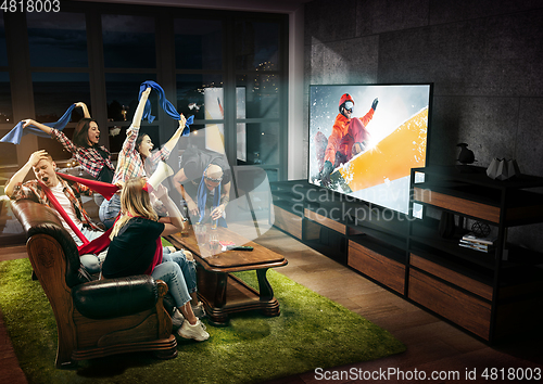 Image of Group of friends watching TV, sport concept, leisure activity