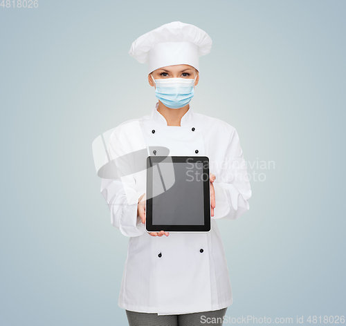 Image of female chef in face mask with tablet pc computer