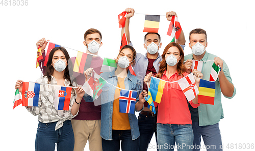 Image of people in respirators with international flags