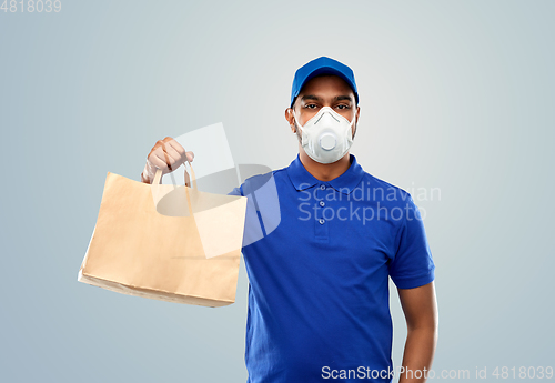 Image of delivery man in respirator mask with paper bag