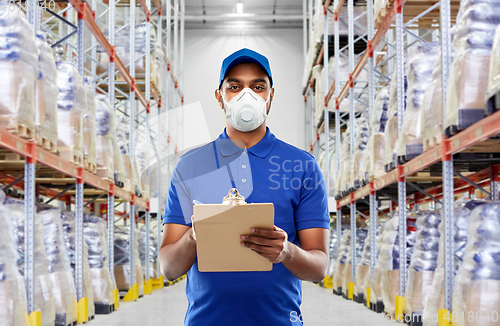 Image of delivery man in mask or respirator at warehouse