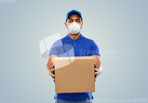 Image of indian delivery man with parcel box in respirator