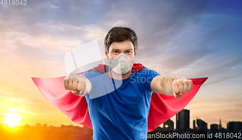 Image of superhero man in respirator flying over city