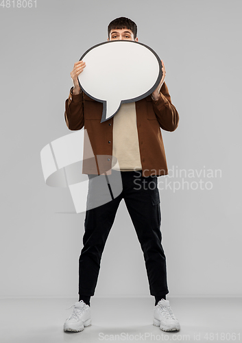 Image of young man with speech bubble over grey background