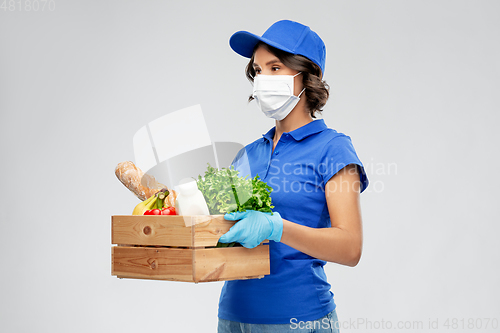 Image of delivery woman in face mask with food in box