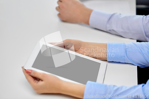 Image of close up of businesswoman with tablet pc at office