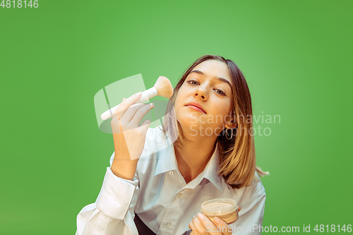 Image of Teen girl dreaming about future profession of makeup artist