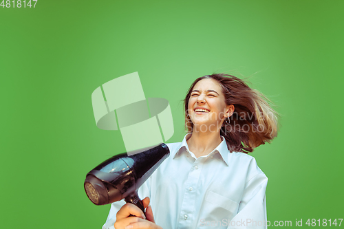 Image of Teen girl dreaming about future profession of makeup artist