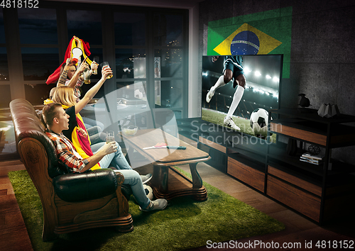 Image of Group of friends watching TV, sport concept, leisure activity