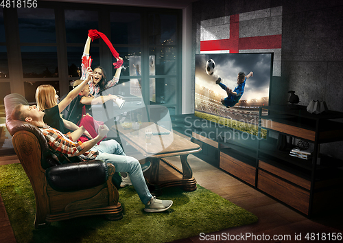 Image of Group of friends watching TV, sport concept, leisure activity