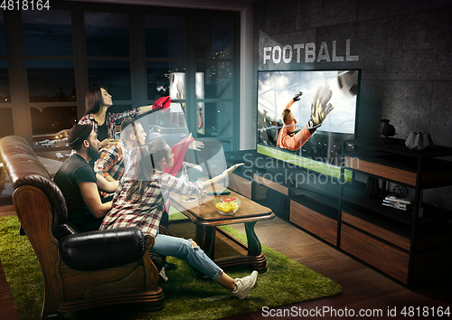 Image of Group of friends watching TV, sport concept, leisure activity
