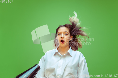 Image of Teen girl dreaming about future profession of makeup artist