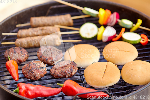 Image of barbecue kebab meat and vegetables on grill