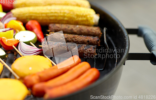 Image of barbecue kebab meat and vegetables on grill