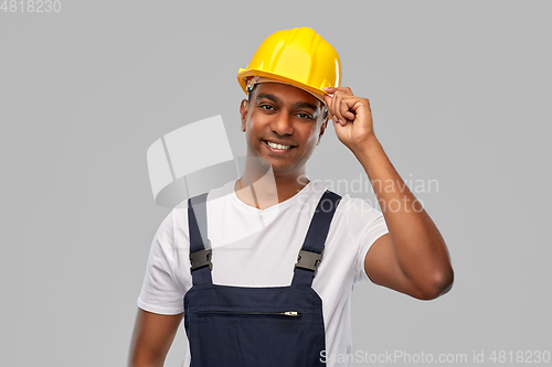 Image of happy smiling indian worker or builder in helmet