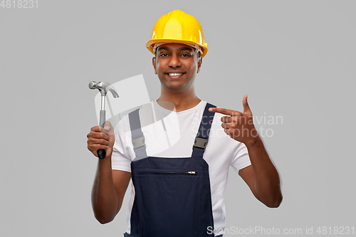 Image of happy smiling indian worker or builder with hammer