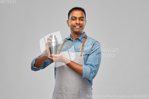 Image of indian barman in apron with cocktail shaker