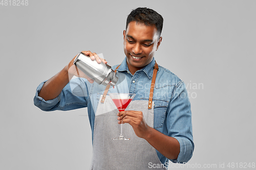 Image of indian barman with glass of cocktail and shaker