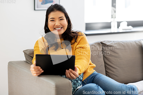 Image of asian young woman with tablet pc computer at home
