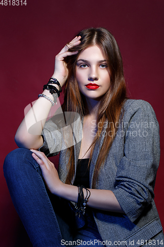 Image of beautiful girl in jacket with red lips