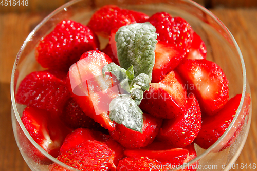 Image of ripe strawberries in a transparent bowl