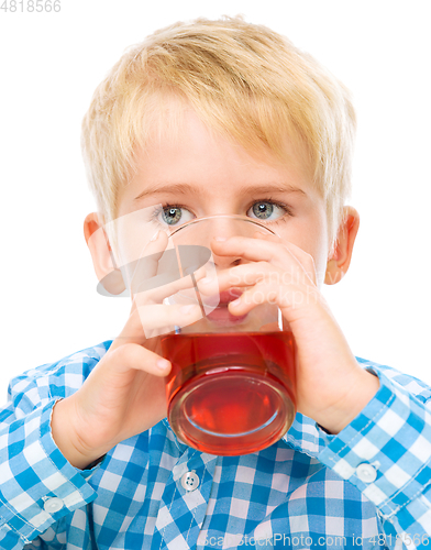 Image of Little boy with glass of cherry juice