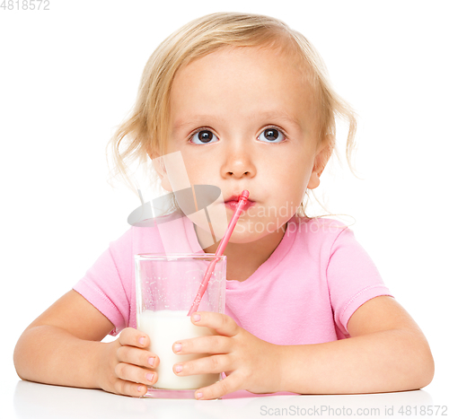 Image of Cute little girl with a glass of milk