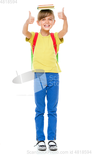 Image of Portrait of a cute little schoolgirl with backpack