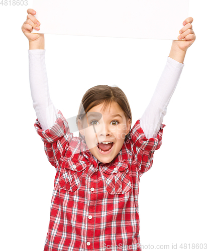 Image of Little girl is holding a blank banner