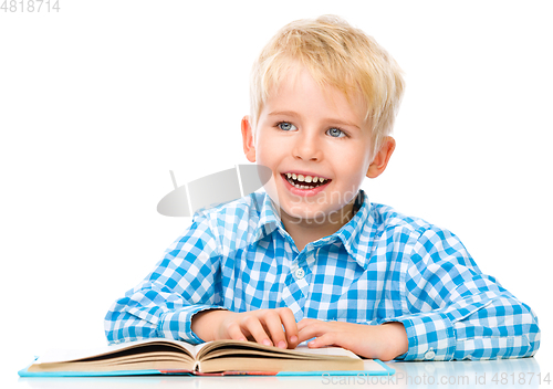 Image of Little child play with book