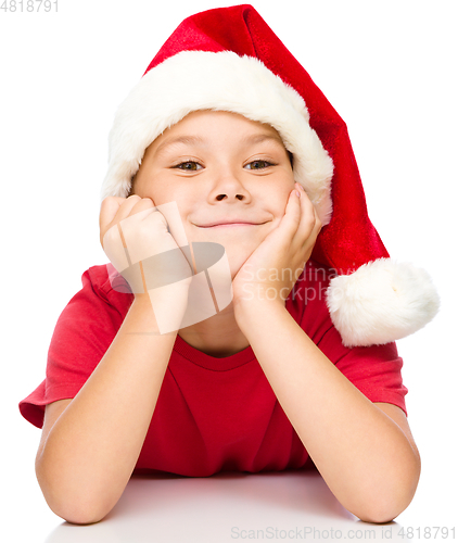 Image of Portrait of a cute little girl in santa hat