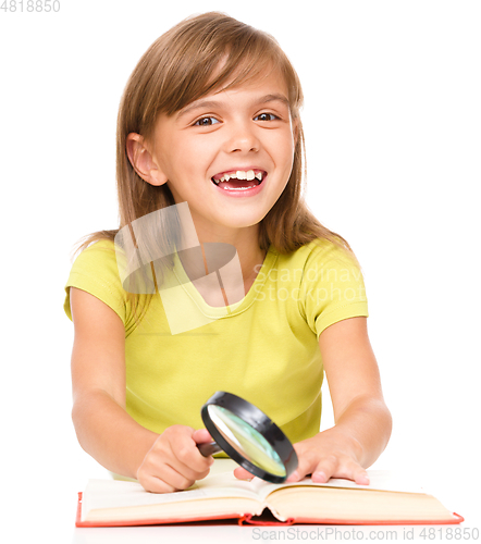 Image of Little girl is reading book