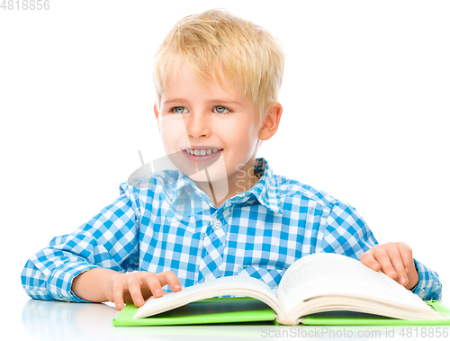 Image of Little child play with book