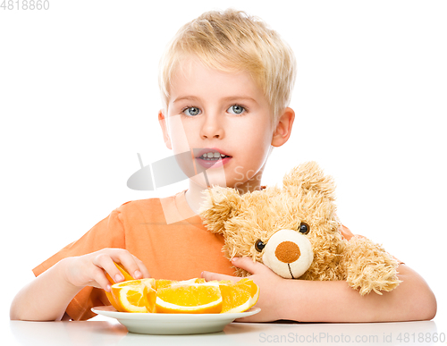 Image of Portrait of a little boy with his teddy bear