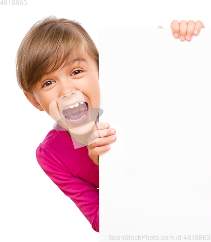 Image of Little girl is looking out from the blank banner