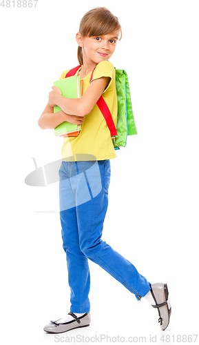 Image of Portrait of a cute little schoolgirl with backpack
