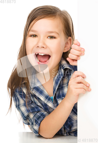 Image of Little girl is looking from out blank board