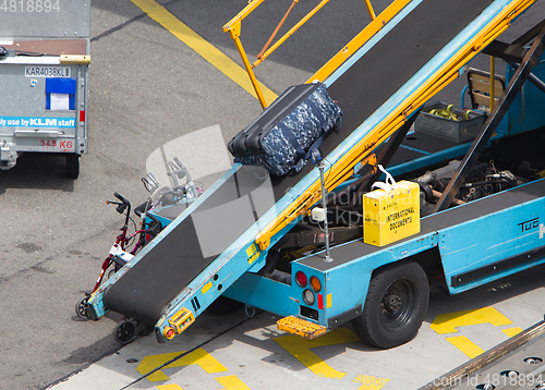 Image of AMSTERDAM, NETHERLANDS - JUNE 29, 2017: Loading luggage in airpl