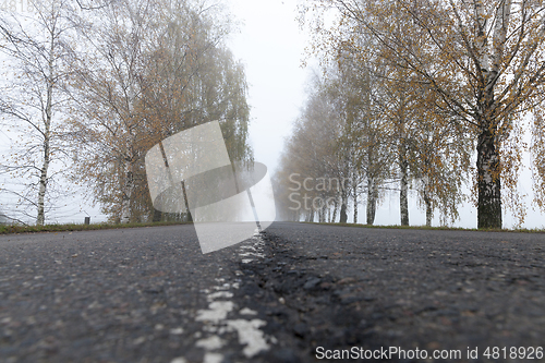 Image of Asphalt road into the fog