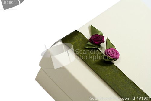 Image of white gift box with green decoration