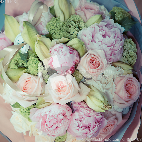 Image of beautiful modern wedding bouquet on white table