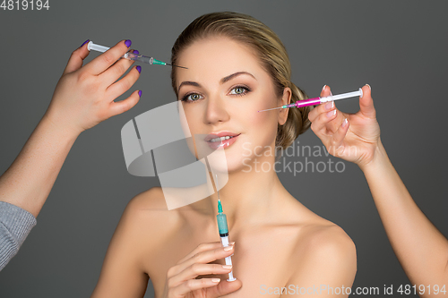 Image of beautiful girl getting beauty injections